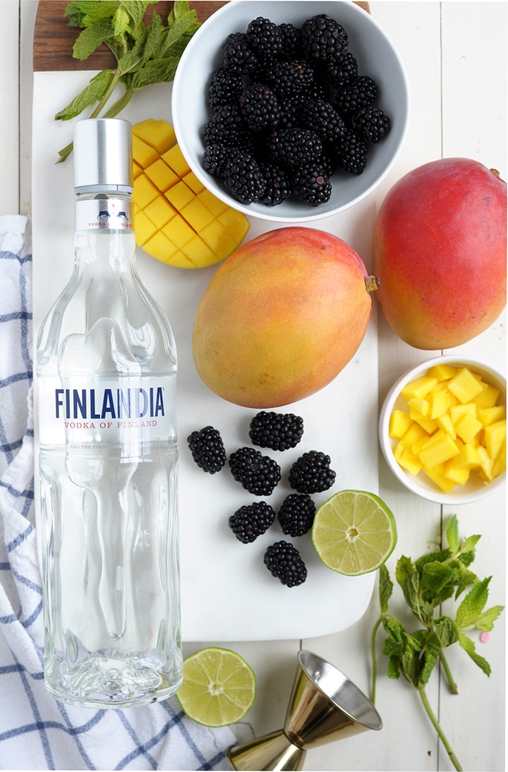 Love making these Mango Blackberry Vodka Cocktails for a summer party. Serve in mason jars!
