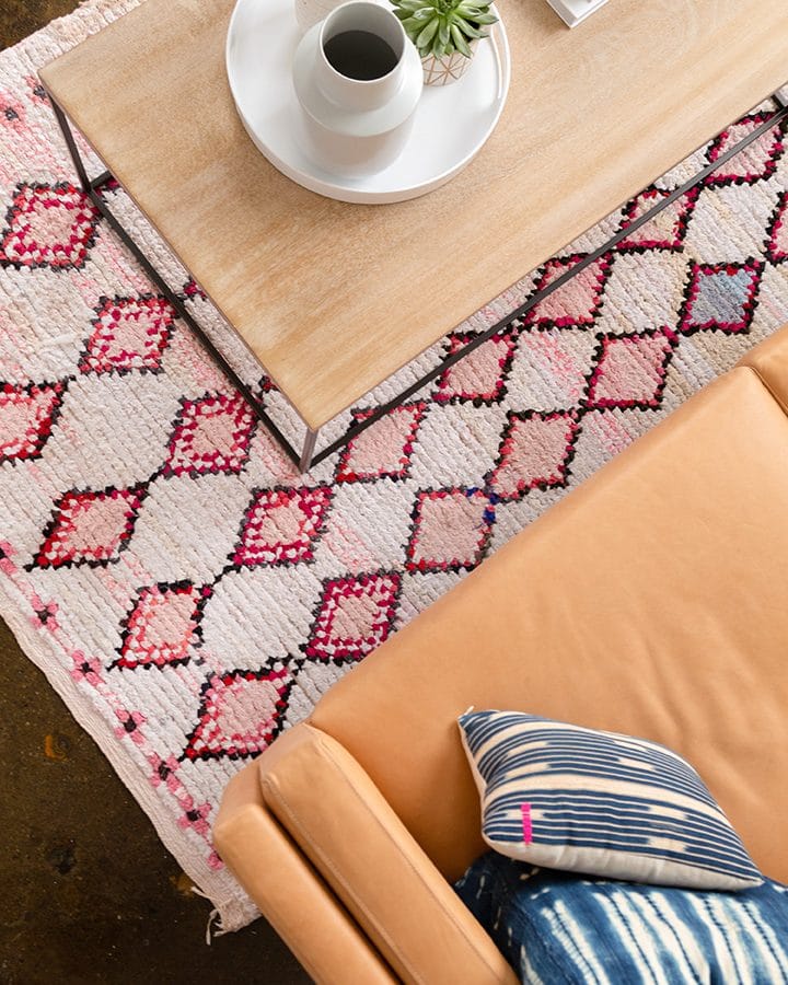 Leather couch and coffee table with moroccan rug